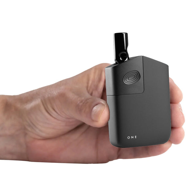 POTV ONE vaporizer in hand with a glass stem